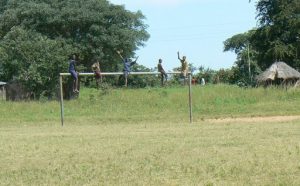 Kids waving hello north of Okavango Delta