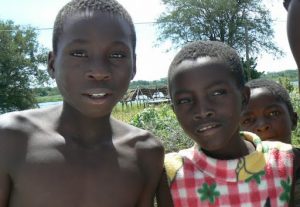 Local kids love their photos taken, then ask for money.