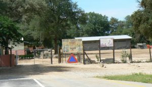 Schoolyard north of Okavango Delta with AIDS prevention poster