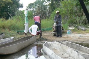 Transfering from motorboat to mokoro canoes