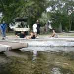 Transfering from motorboat to mokoro canoes