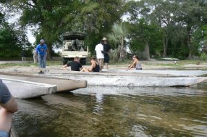 Transfering from motorboat to mokoro canoes