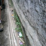 Separate plastic pipes bring water to various houses