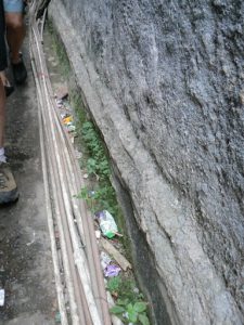 Separate plastic pipes bring water to various houses