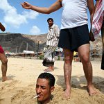 Yemen - playful friends at the beach along the Red