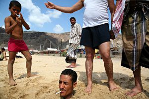 Yemen - playful friends at the beach along the Red