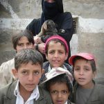 Yemeni kids; note boy on left is wearing a ceremonial