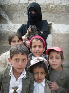 Yemeni kids; note boy on left is wearing a ceremonial