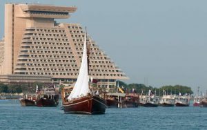 About hundred and fifty Qatari traditional dhows sailing near the