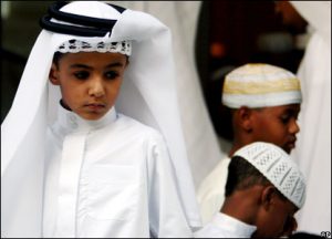 Bahrain - Boys attend Eid al-Fitr dawn prayers at a