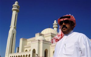 Bahrain - man in front of Grand Mosque  (photo-telegraph.co.uk)