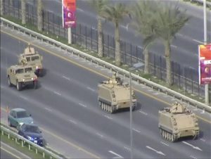 In this image from video armored personnel carriers roll towards