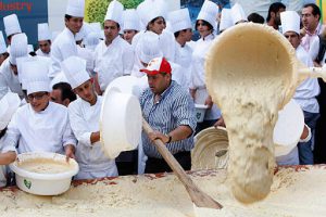 Lebanon - chefs prepare a massive bowl of hummus, weighing