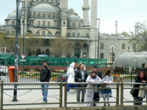 Turkey, Istanbul - pedestrians along the harbor front in front