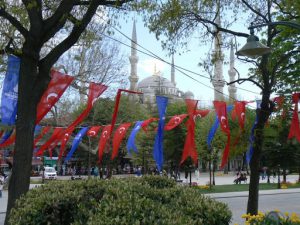 Turkey, Istanbul - flags at Blue Mosque