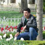 Turkey, Istanbul - visitor posing in Sultan's Garden at Blue