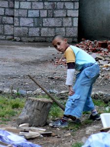 Macedonia, Ohrid City - local boy chopping wood
