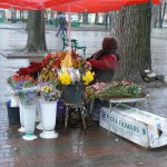 Ukraine, Odessa - flower vendor on a rainy day