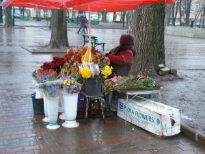 Ukraine, Odessa - flower vendor on a rainy day