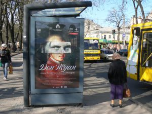 Ukraine, Odessa - bus stop poster for Mozart's opera Don
