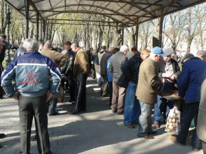 Ukraine, Odessa - men gathered around chess and checkers games