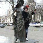 Ukraine, Odessa - bronze statue with cathedral in background