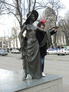 Ukraine, Odessa - bronze statue with cathedral in background