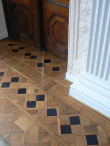 Intricate parquet floor and door frame in the palace