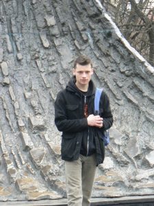 Ukraine, Lviv - central city; handsome visitor at  wave-shaped relief