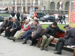 Ukraine, Lviv - central city: locals hanging out and playing checkers