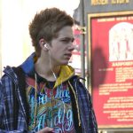 Ukraine, Lviv - young guy with iPod