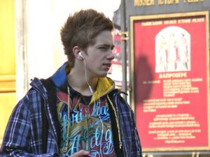 Ukraine, Lviv - young guy with iPod