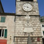 Clock tower with pyramid pillory post