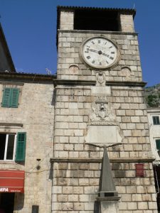 Clock tower with pyramid pillory post