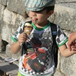 Little boy with ice cream on face