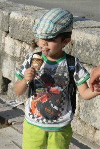 Little boy with ice cream on face