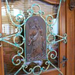 Ornate door with carving of Poisedon