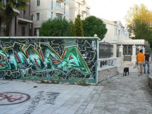 Montenegro, Podgorica: two guys walking their dog