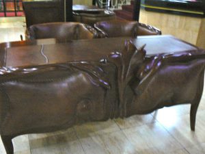 Montenegro, Podgorica: ornate animal carved desk in hotel