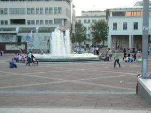 Montenegro, Podgorica: central plaza fountain with kiddie go-carts