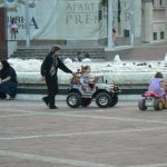 Montenegro, Podgorica: central plaza fountain and kiddie go-carts