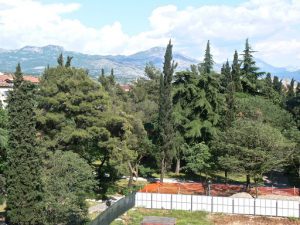 Montenegro, Podgorica: mountains beyond the city; in foreground is ground-breaking