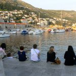Croatia, Dubrovnik: student visitors along the harbor