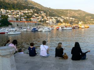 Croatia, Dubrovnik: student visitors along the harbor