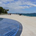 Croatia, Zadar City: view across the 'Sea Organ' and solar