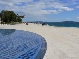 Croatia, Zadar City: view across the 'Sea Organ' and solar