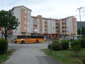 Bosnia-Herzegovina, Mostar City: commuter bus and modern apartment building