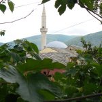 Bosnia-Herzegovina, Mostar City: leafy view of mosque and mountains