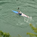 Bosnia-Herzegovina, Mostar City: kayaker begotiating the fast-flowing Neretva River
