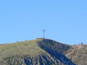 Bosnia-Herzegovina, Mostar City: huge cross on the hill overlooks numerous